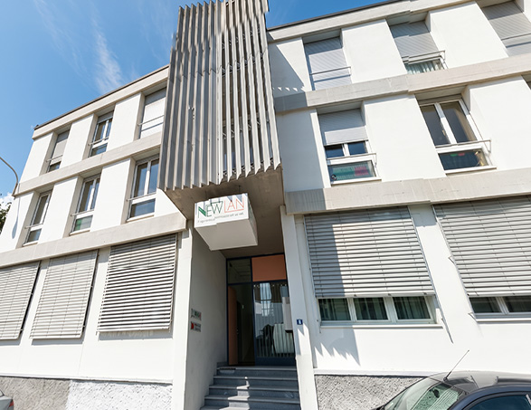 Exterior of the New-Lan SA headquarters in Cadempino, climate-controlled by reliable Clivet heat pump systems.