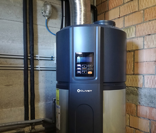 Clivet AQUA SWAN heat pump installed in a domestic laundry room for domestic hot water production.